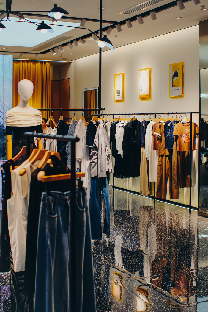 Offerings Interior of a chic fashion boutique showcasing trendy clothing displays and elegant decor.